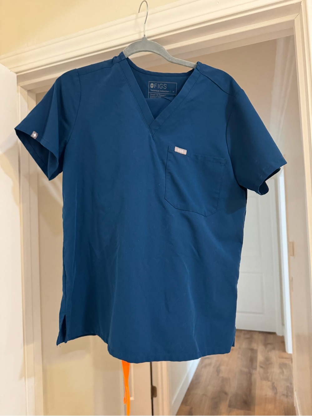 FIGS Women's Short Sleeve V-Neck Scrub  Top and pants set in Deep Reef.